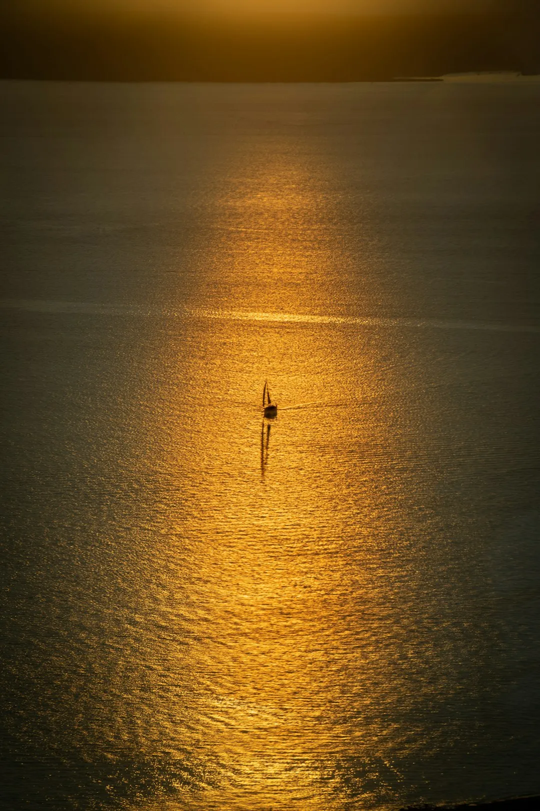 Oil rig at dramatic sunset